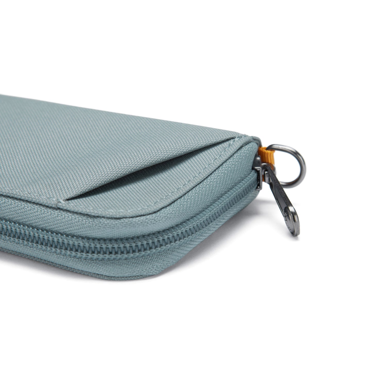Close up of fresh mint Pacsafe® RFIDsafe™ RFID Blocking Card Wallet, side view with sliver zipper.