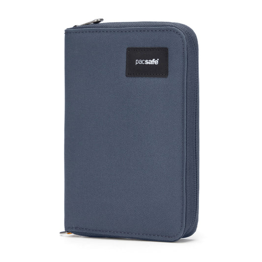 Product Image – A blue Pacsafe RFIDsafe travel organizer, upright with a black logo patch.