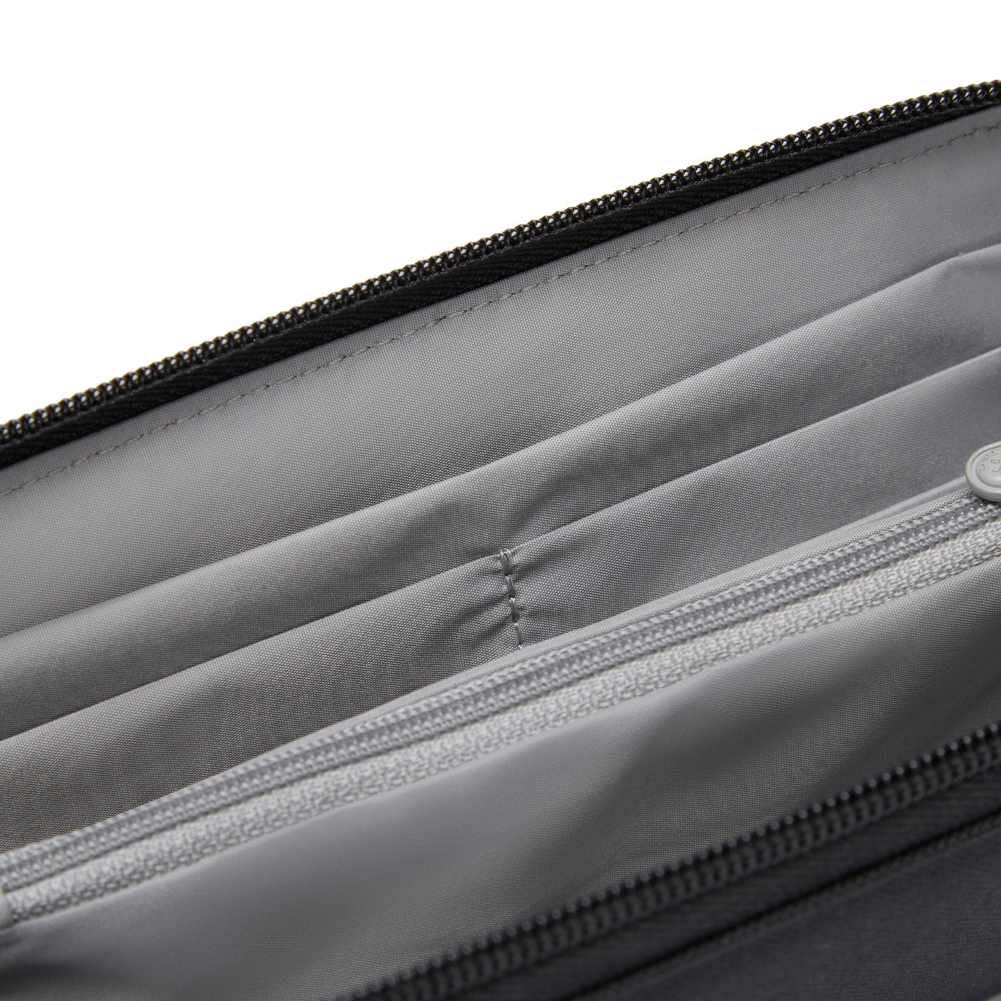 Close-up of a Pacsafe RFIDsafe wallet revealing its inner lining and RFID-blocking details.