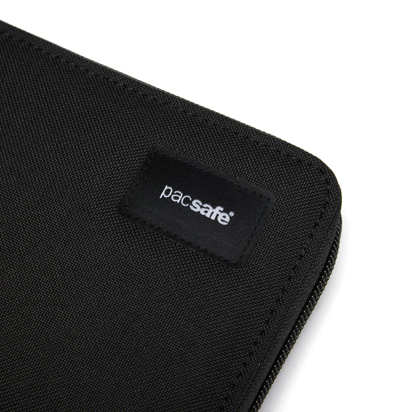 Close-up of a Pacsafe® RFIDsafe™ wallet with logo on an RFID-blocking patch.