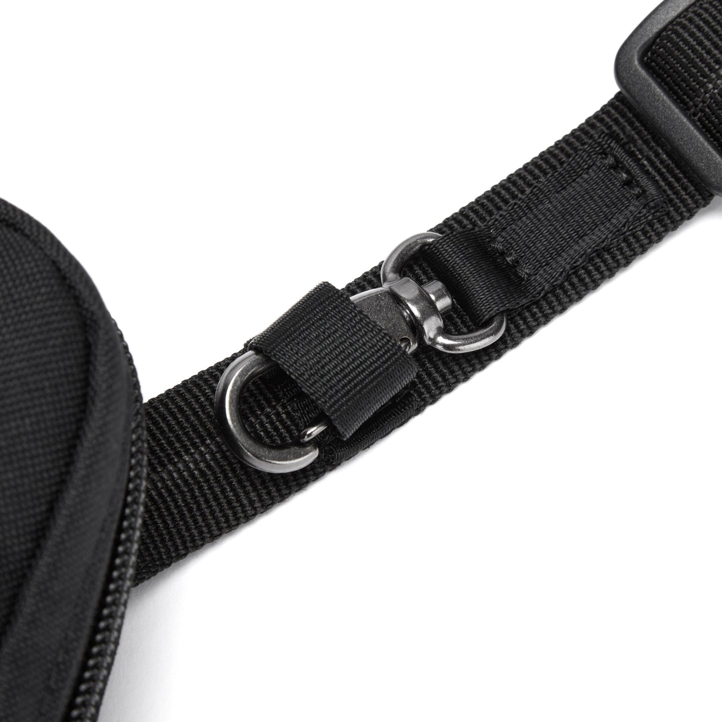 Close-up of black strap with silver rings on Pacsafe® RFIDsafe™ Crossbody, made from recycled polyester.