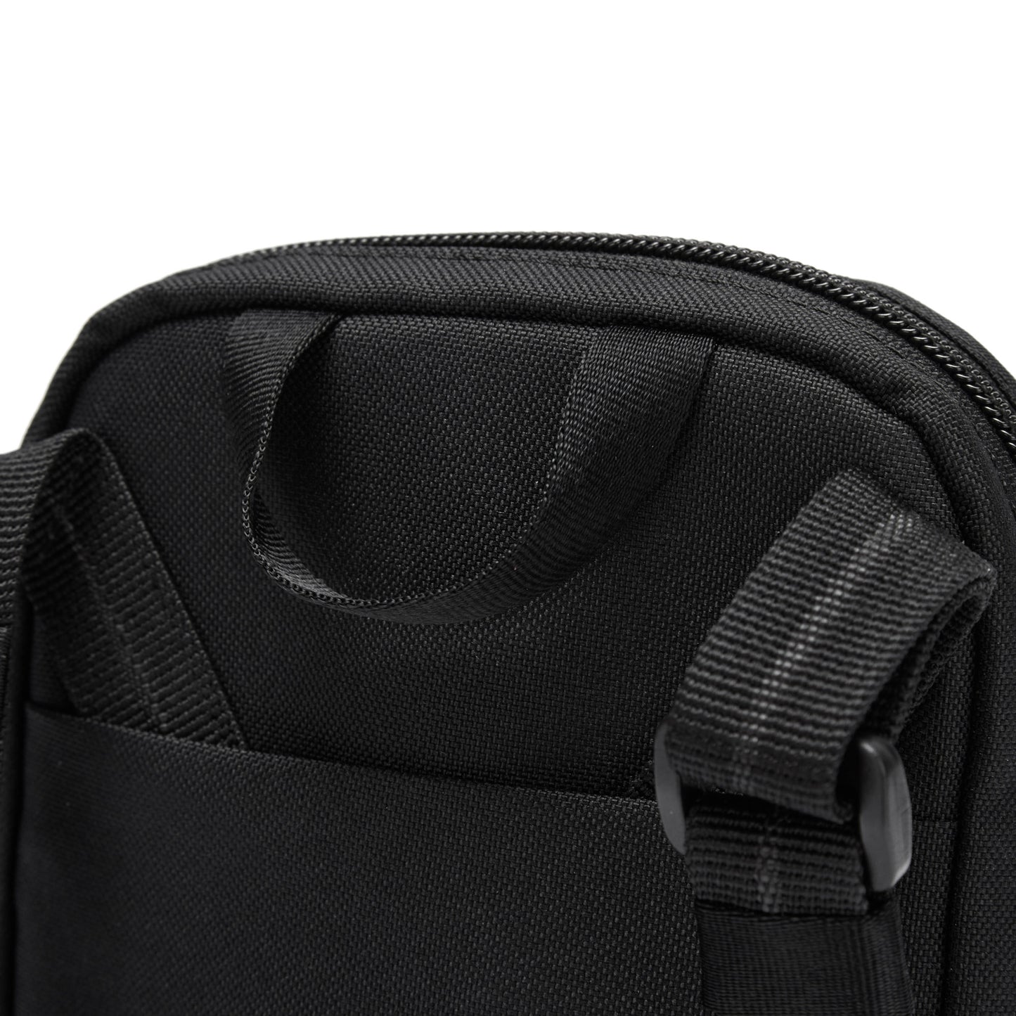 Close-up of the Pacsafe® RFIDsafe™ crossbody in recycled polyester with a zippered top and adjustable straps.