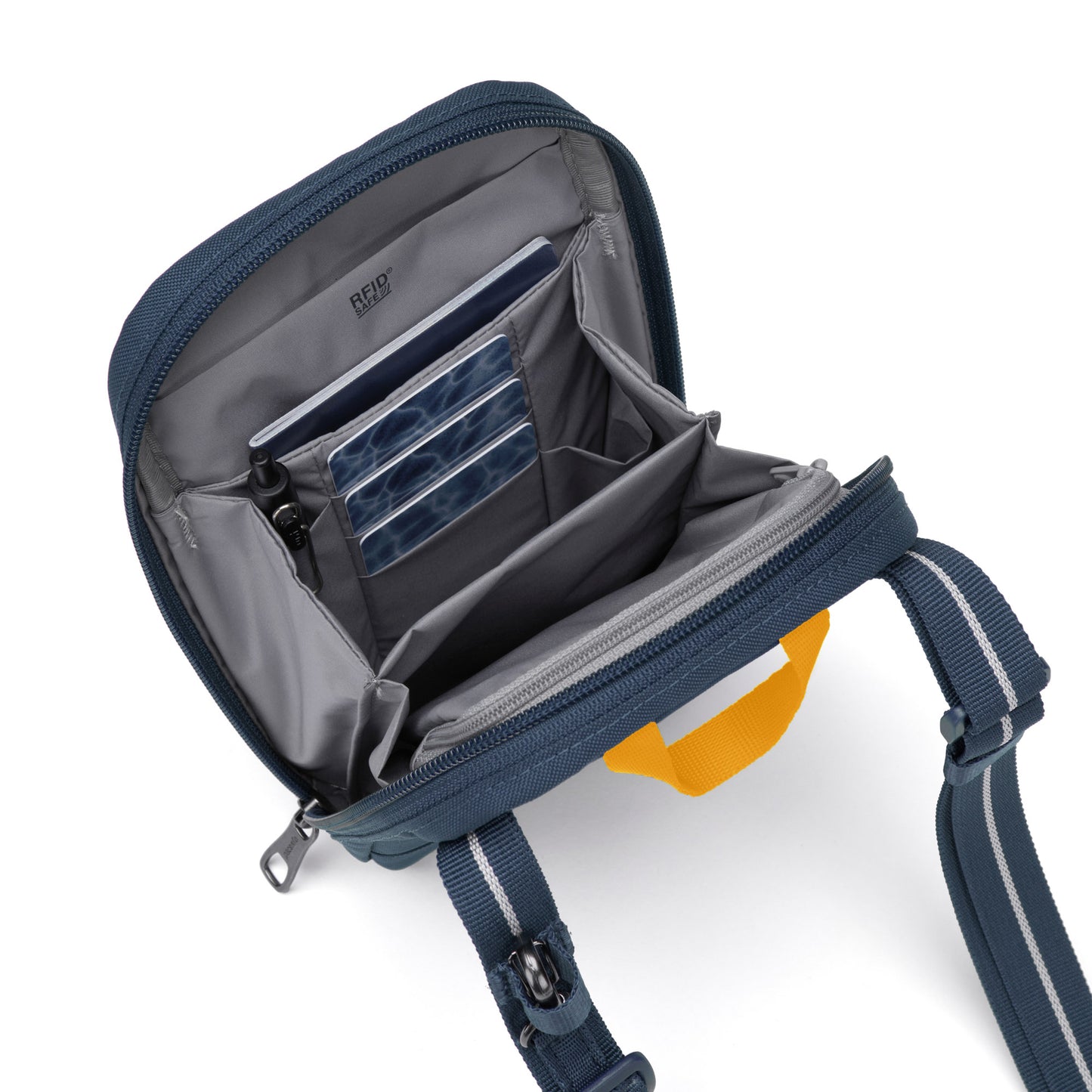Opened Pacsafe® RFIDsafe™ Crossbody, crafted from recycled polyester, revealing interior pockets and a vibrant yellow handle.