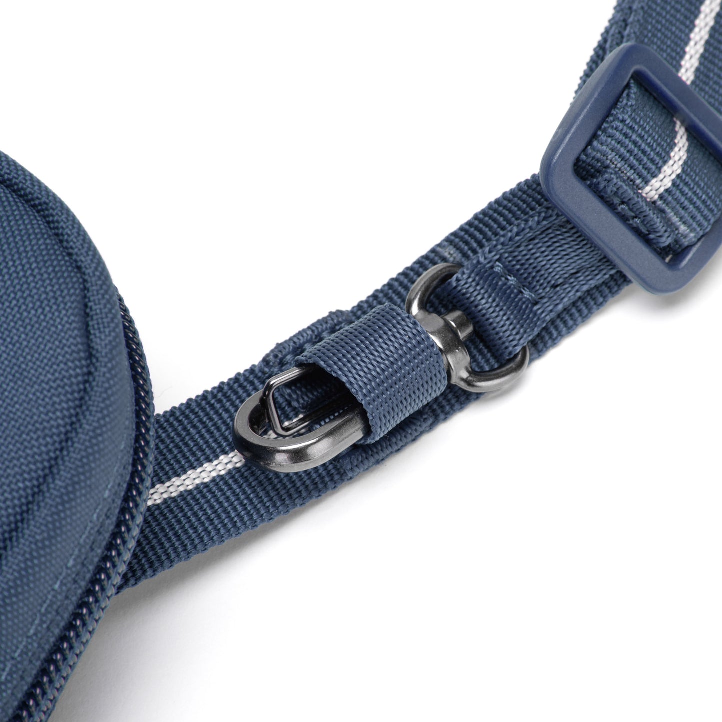 Close-up of the Pacsafe® RFIDsafe™ crossbody's blue recycled polyester strap, buckle, and black metal D-ring.