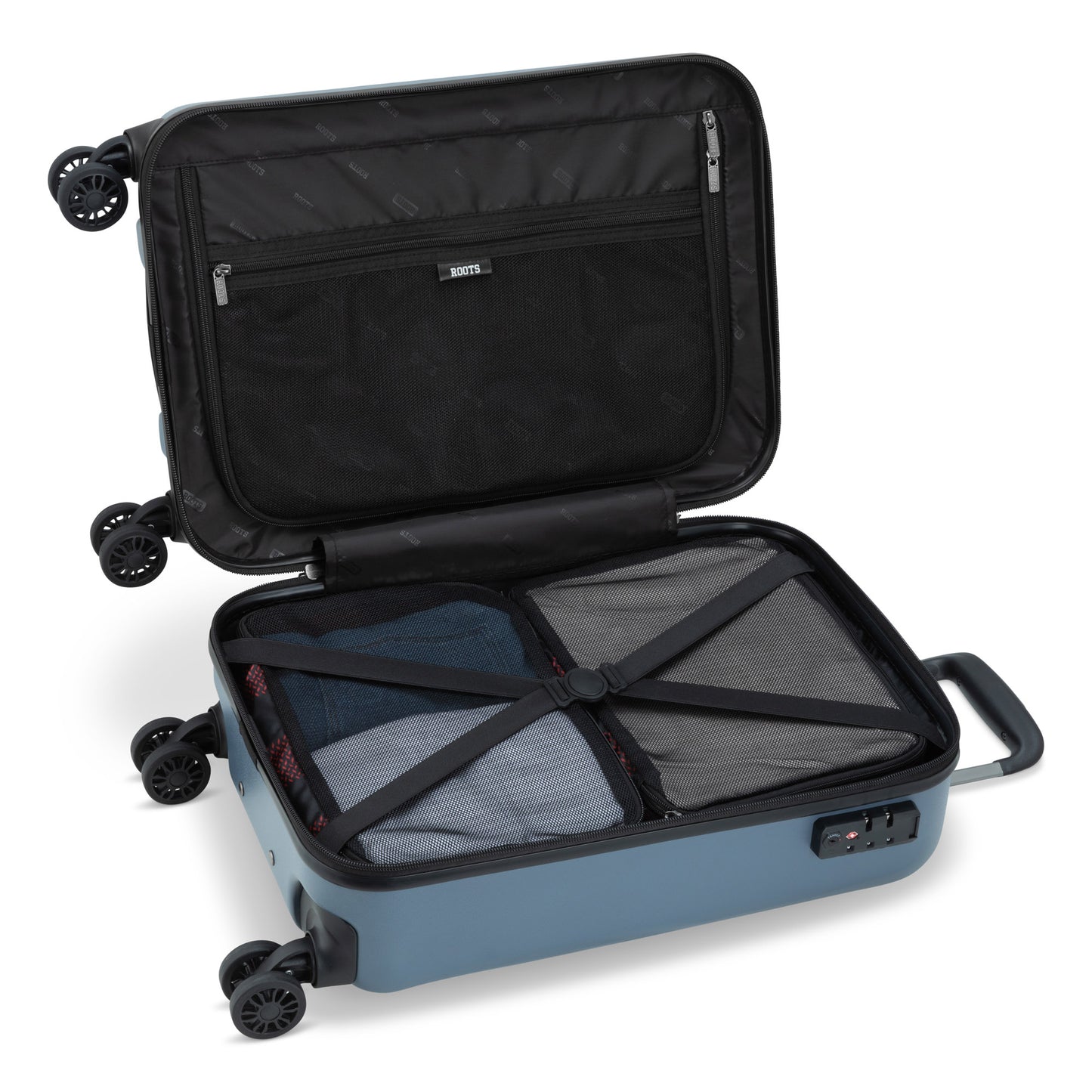 Roots Chalet Hardside Spinner Carry-on, blue, open view with clothes packed inside