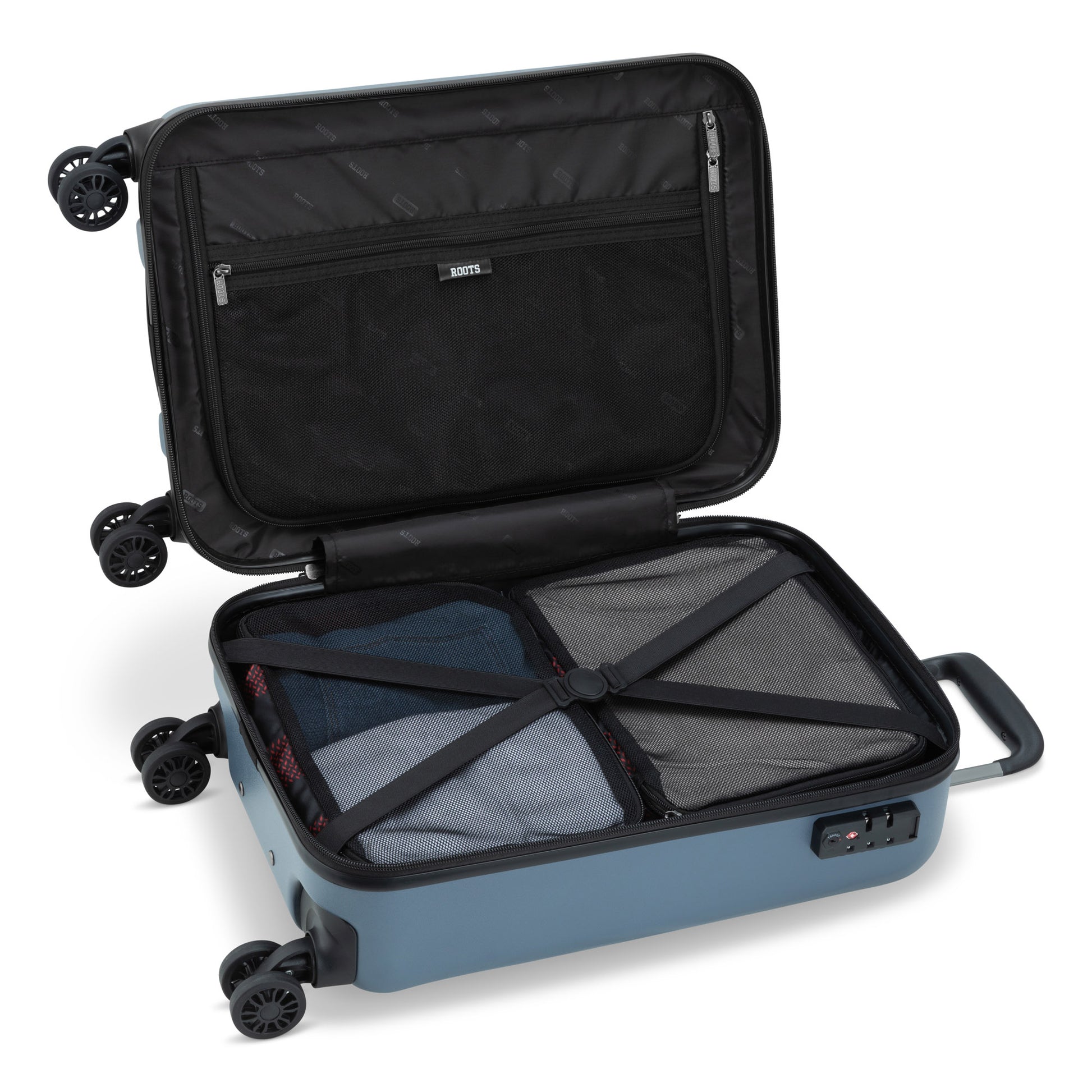 Roots Chalet Hardside Spinner Carry-on, blue, open view with clothes packed inside