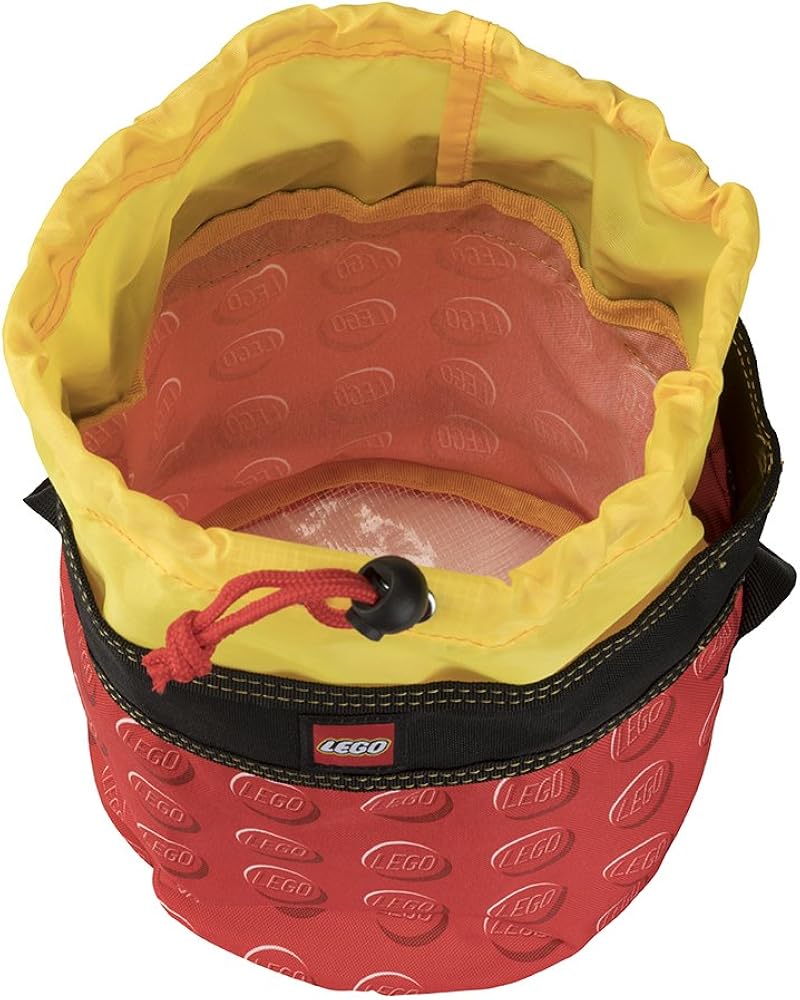 The LEGO® Cinch Bucket - ONLINE ONLY is water-resistant with a handle, logo pattern, and black drawstring trim.
