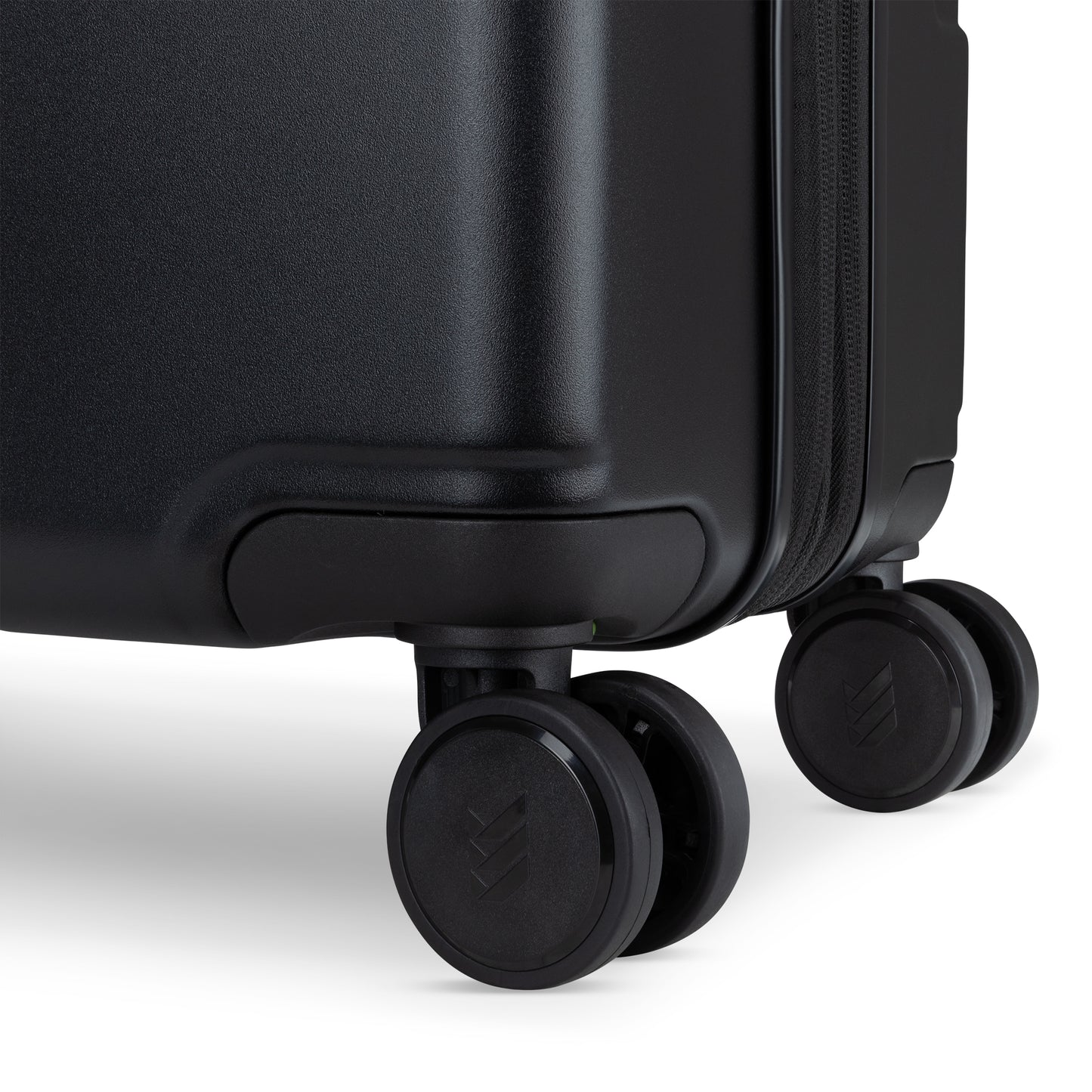 Close-up of Travelite Itinerary Large Expandable Hardside Spinner in black with double spinner wheels.
