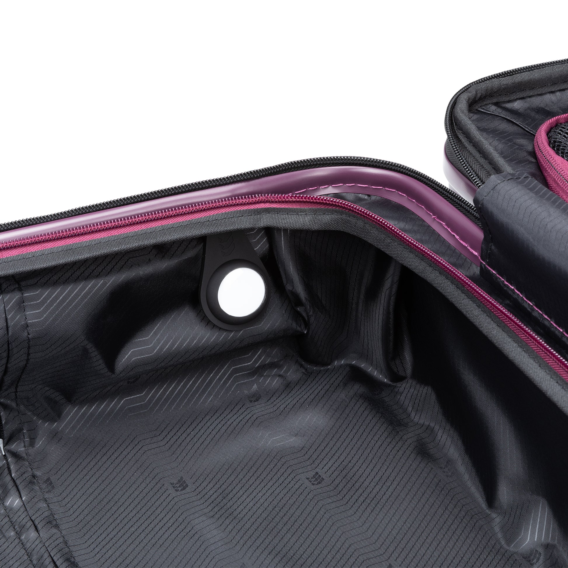 The Travelite Itinerary Medium Hardside Spinner includes a tracker holder inside.
