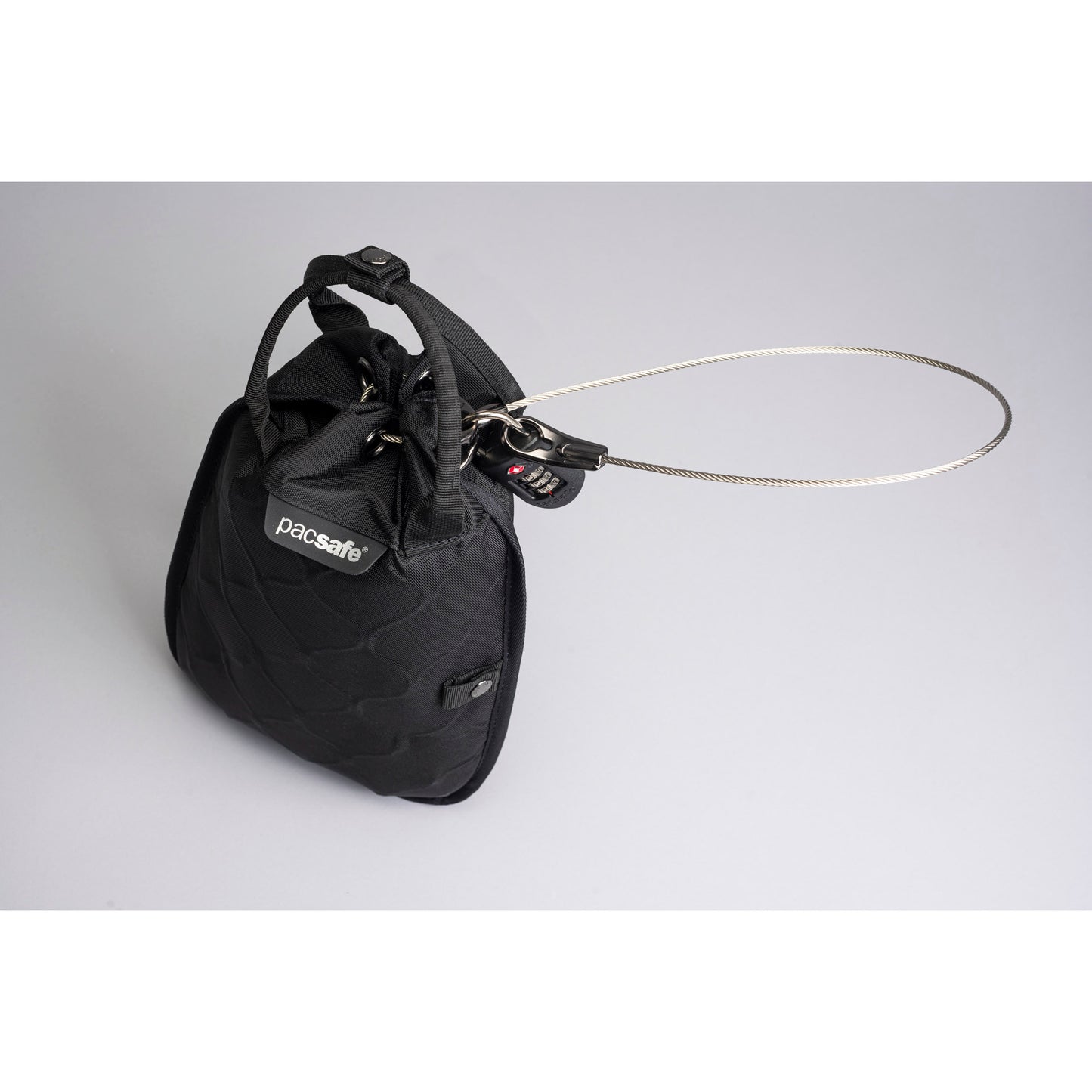 Pacsafe Travelsafe 3L GII, an anti-theft portable safe with cable and lock, made from recycled polyester.