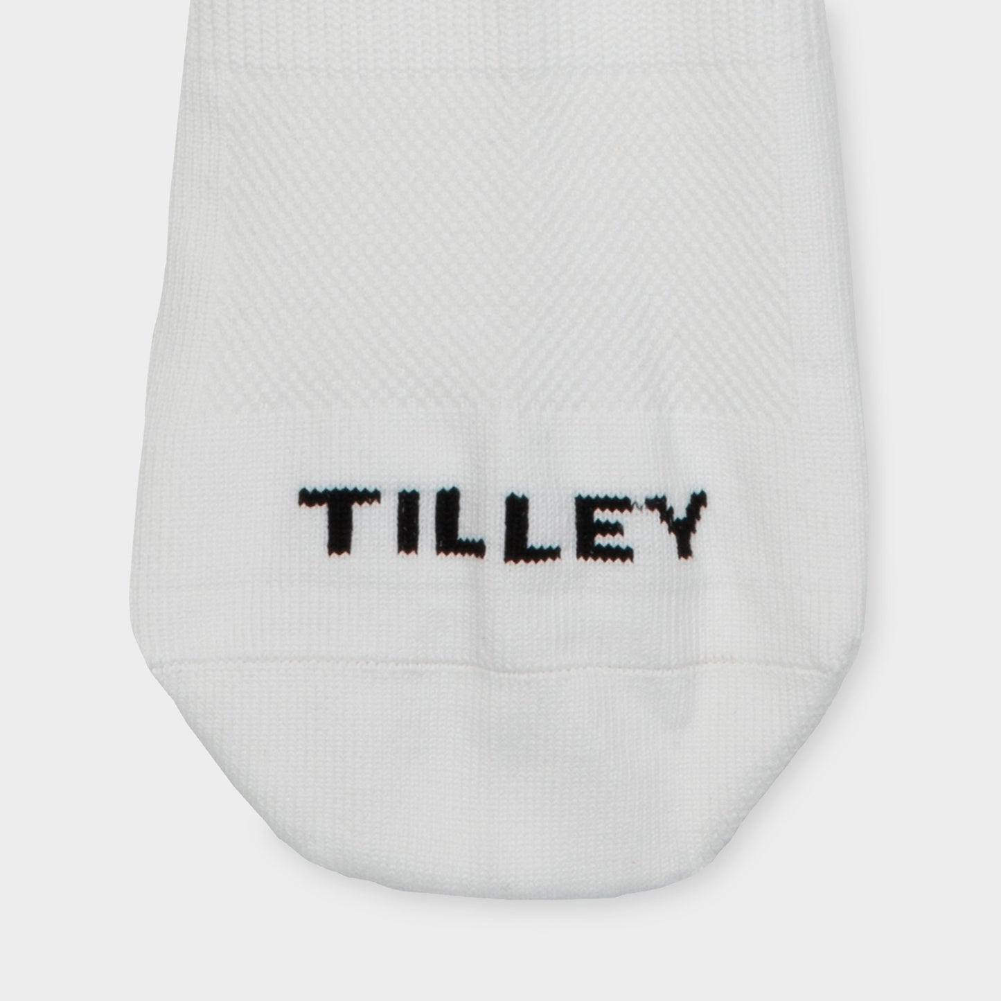 Tilley Mid Calf Travel Sock in white with "TILLEY" embroidery and arch support. Online only.