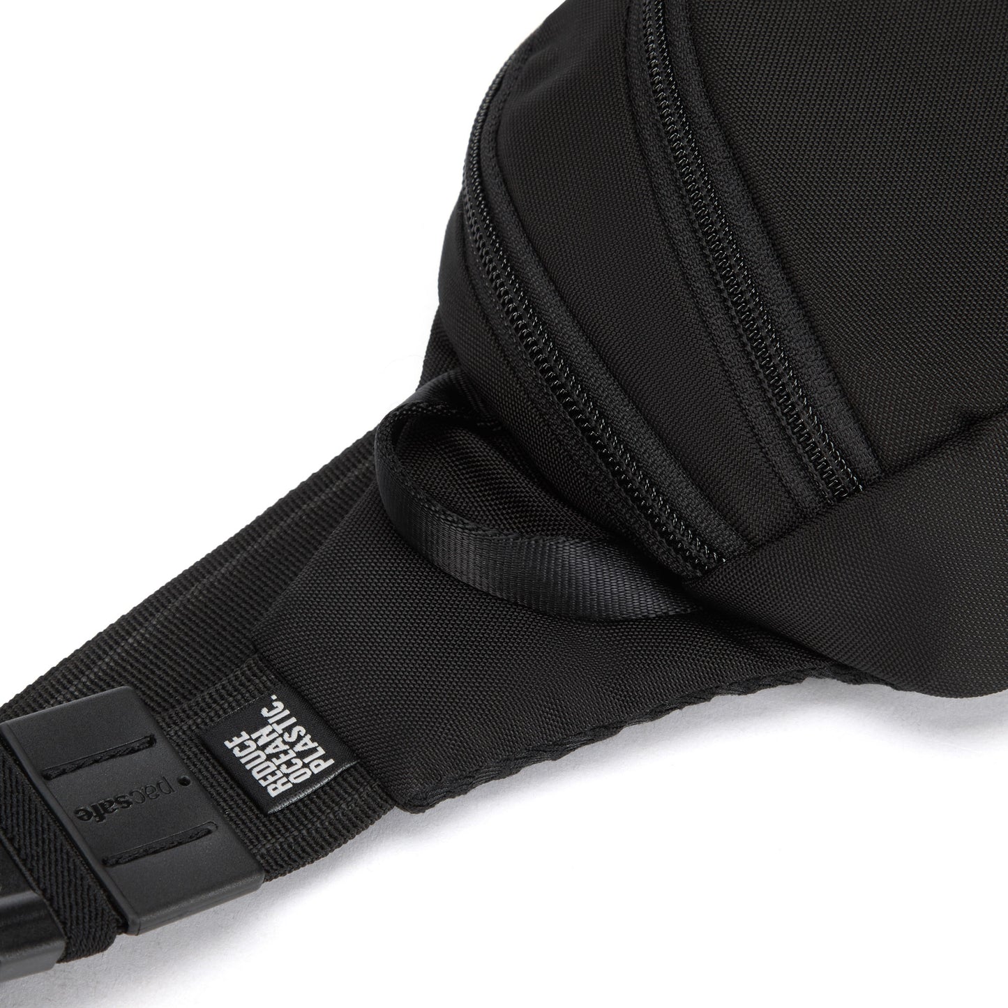 Close-up of the black Pacsafe® V Anti-theft Action Sling Pack with a side zipper and "reduce ocean plastic" tag.