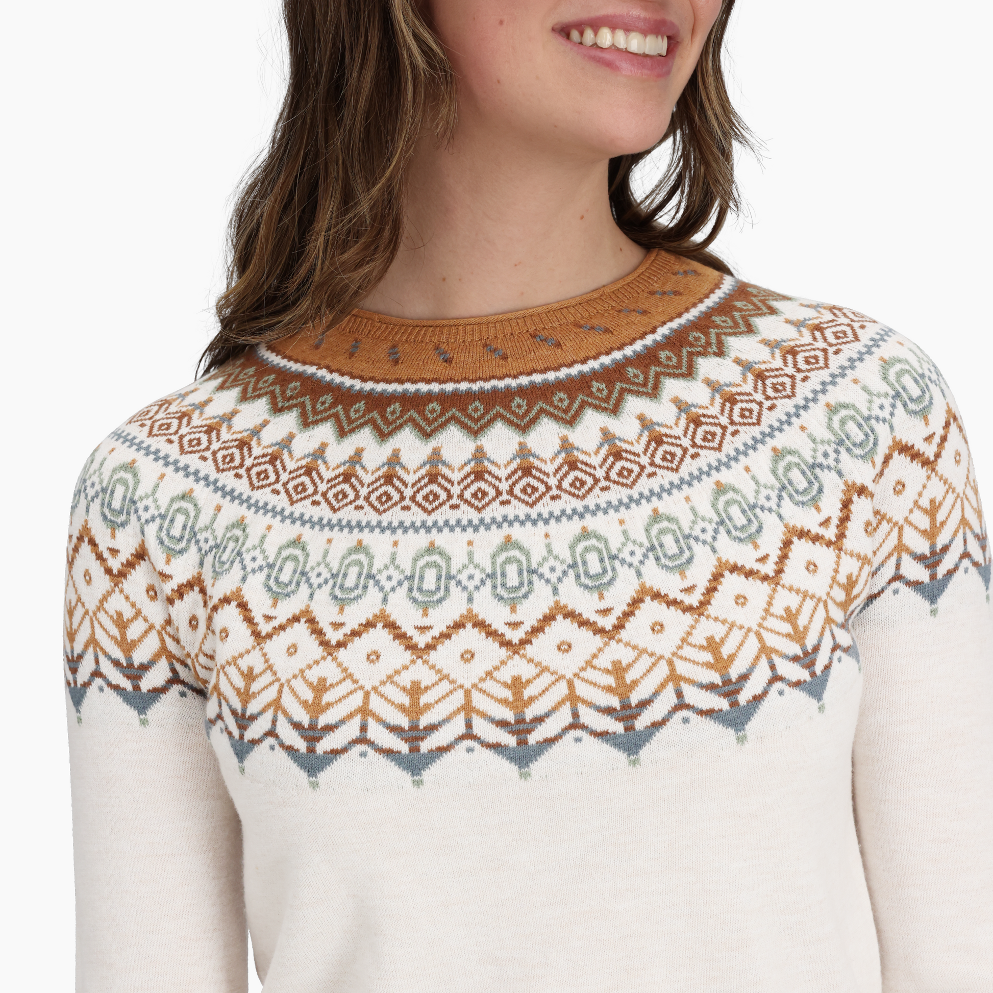 Woman wears the Royal Robbins Women's Westlands Fairisle Crew with a geometric multicolor yoke pattern.