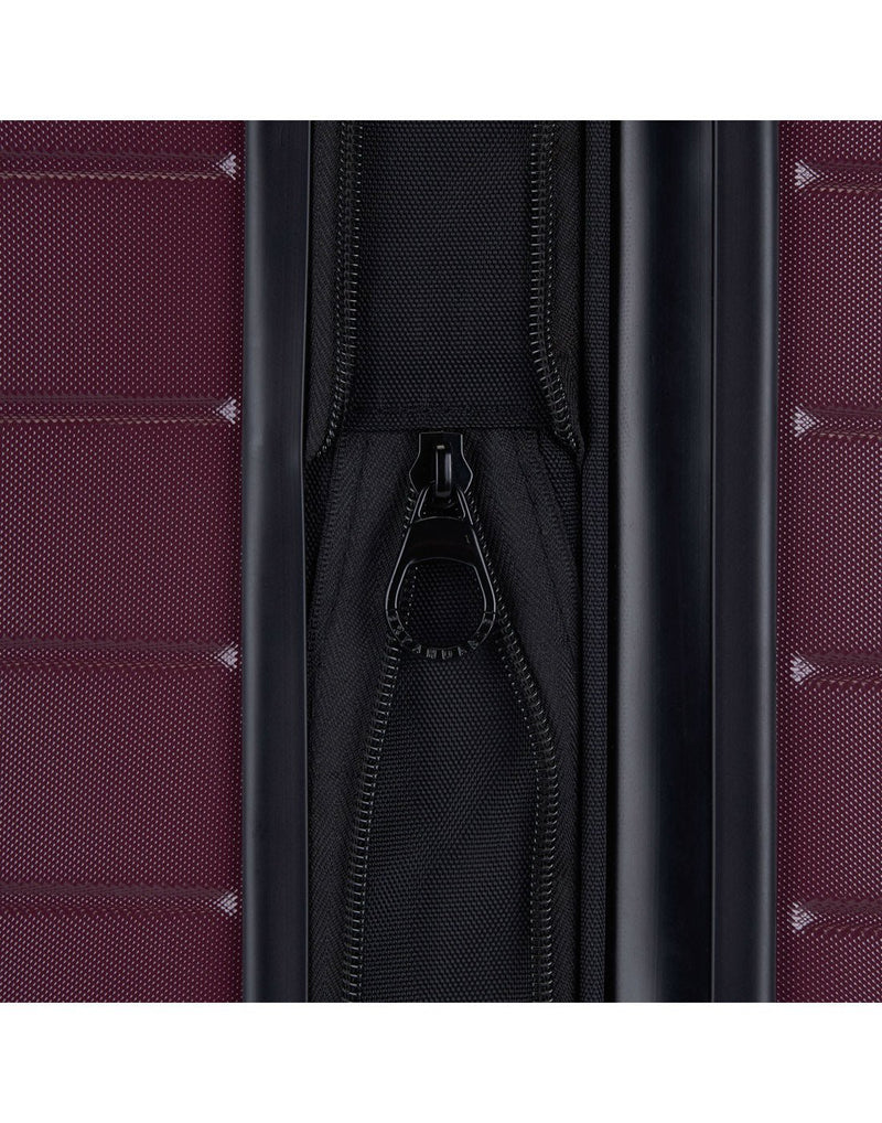 Bugatti Hamburg Hardside Carry-on Spinner in Red Lacquer colour, close-up view of the  zipper-release expansion system that provides 20% more packing space.