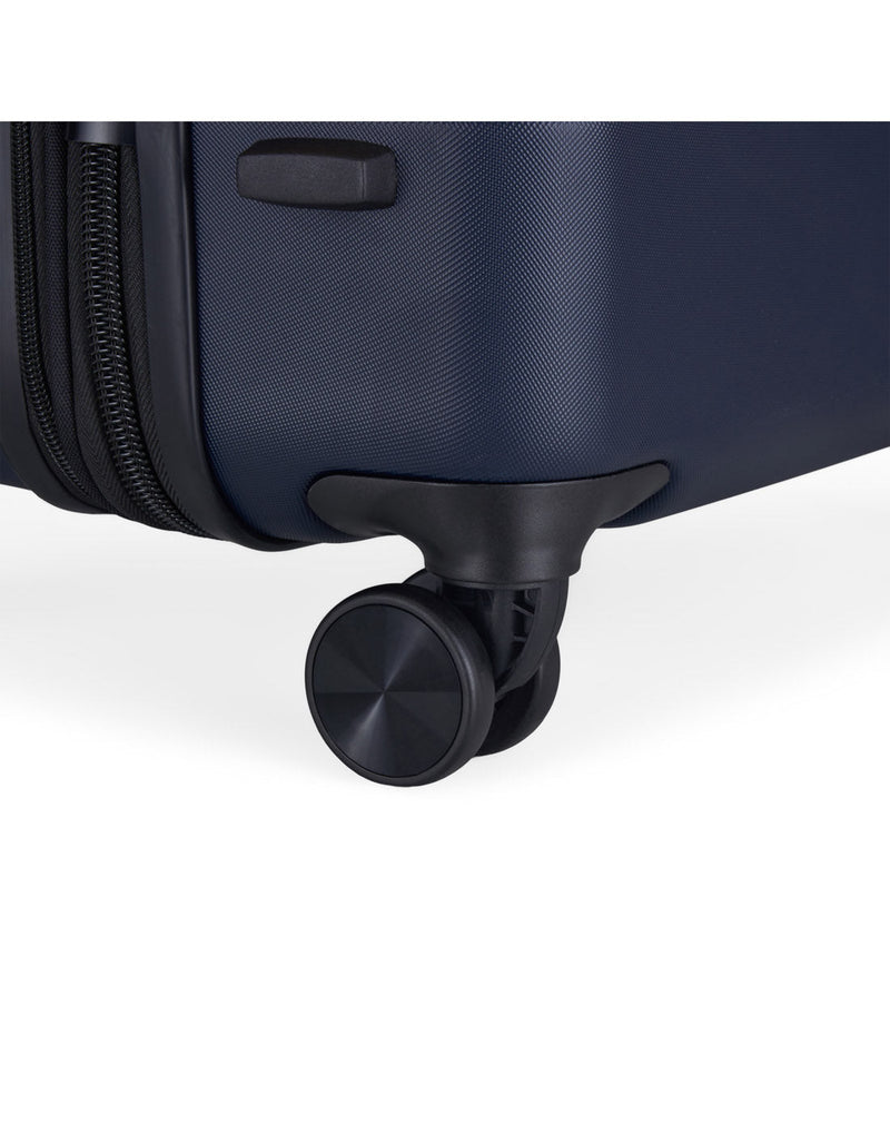 Bugatti Wellington Hardside 24" Expandable Spinner in Navy, close-up view of  a spinner wheel.