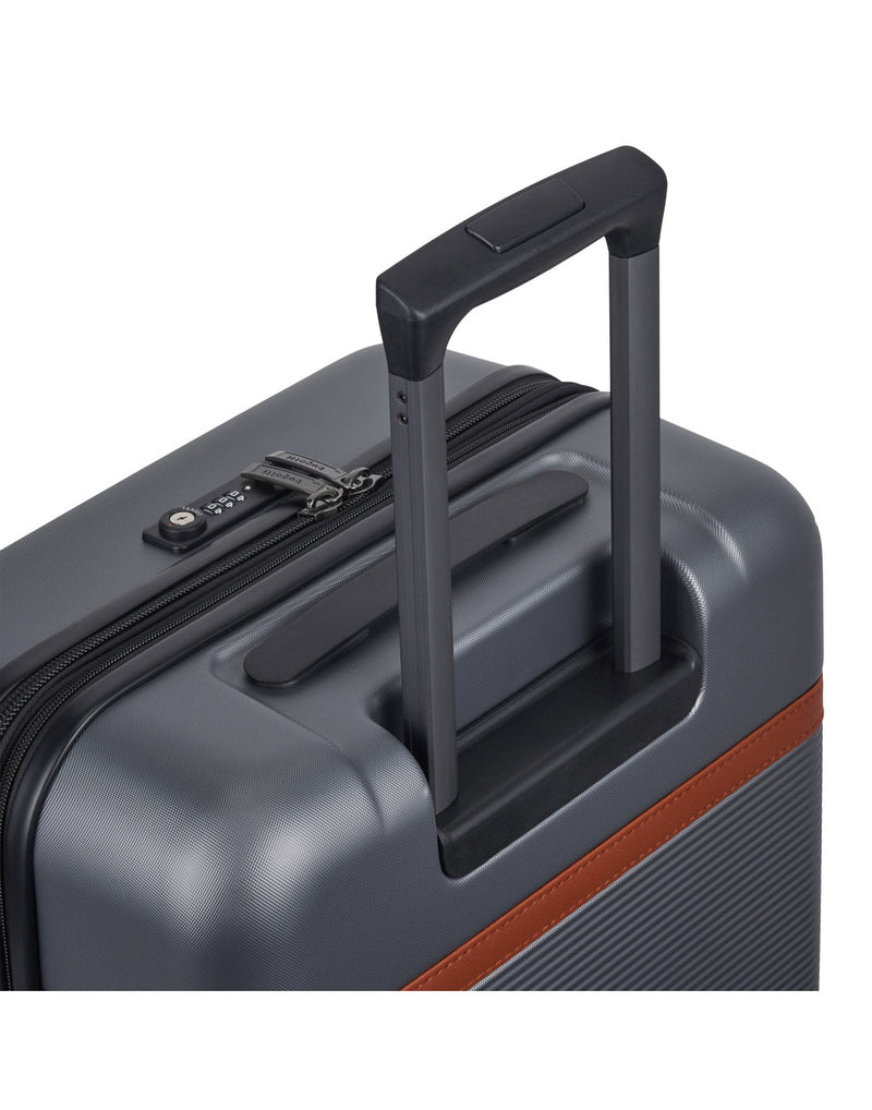 Bugatti Wellington Hardside 24" Expandable Spinner in Pewter colour, close-up view  showing the TSA combination lock and telescopic trolley handle.