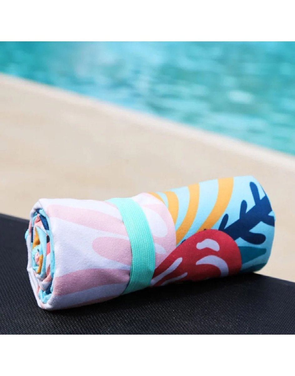 The K5 Microfibre Beach Towel with blue strap is ultra-absorbent, compact, and perfect for poolside lounging.
