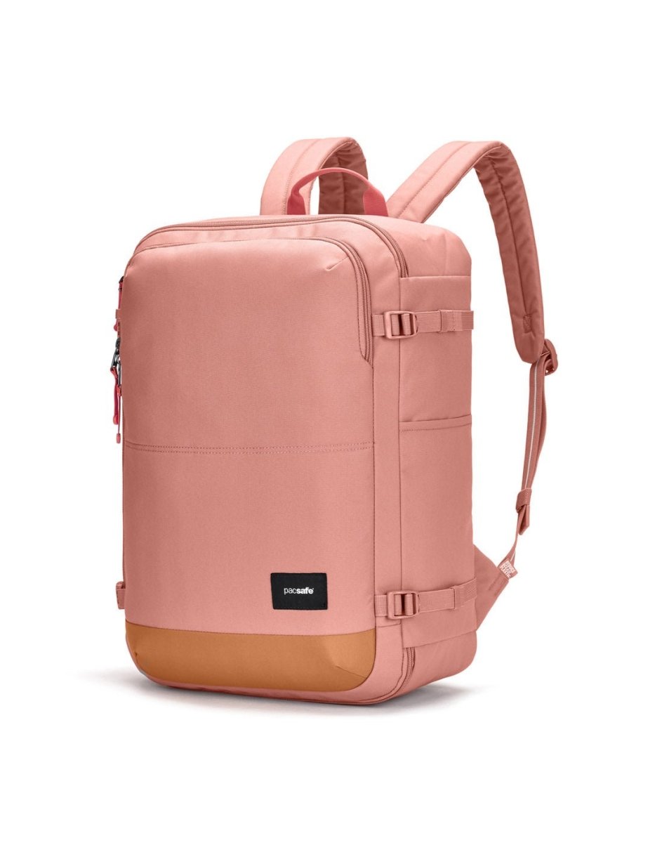Pacsafe® GO 34L pink anti-theft carry-on backpack with padded straps, tan bottom, and lockable compartment.