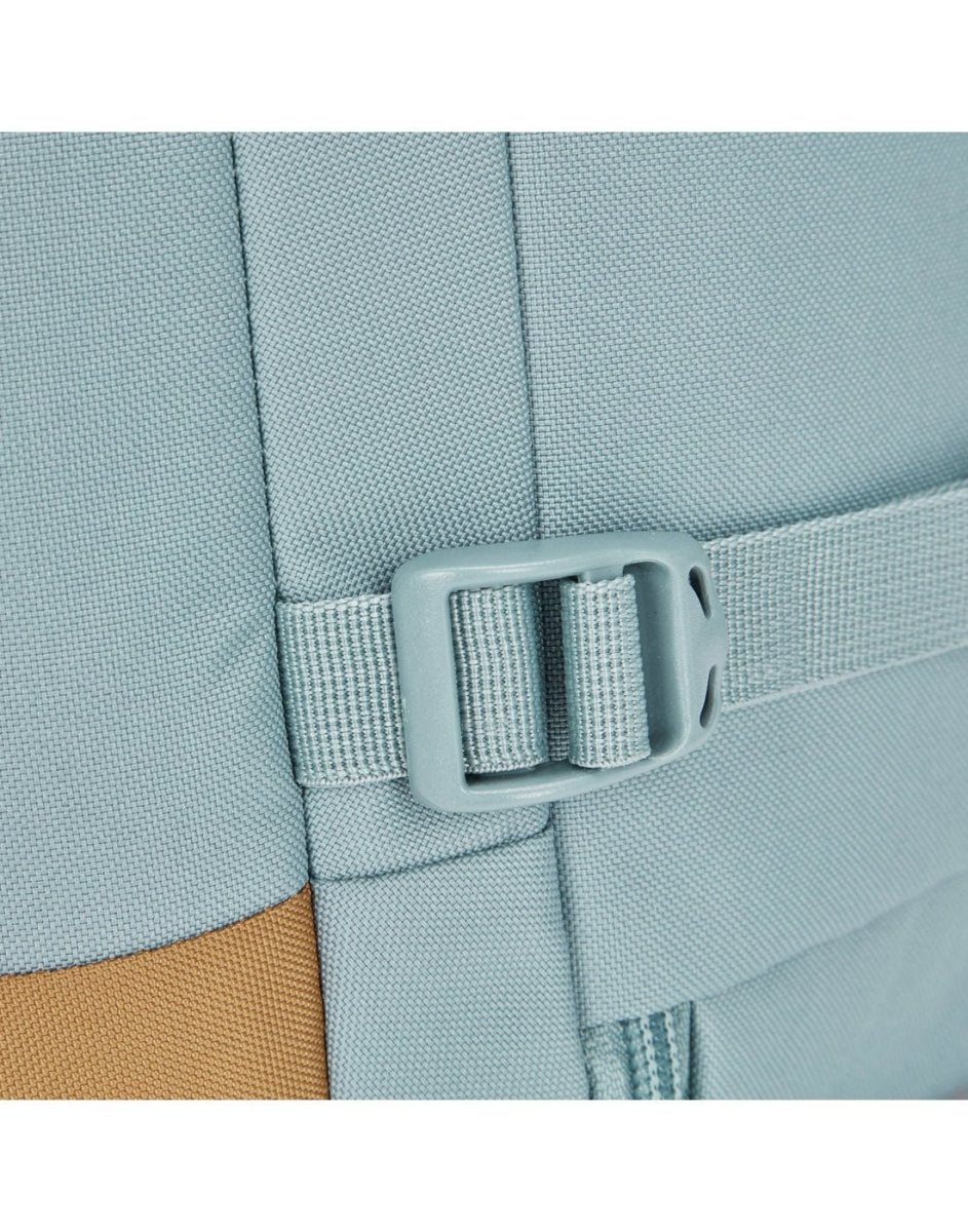 Close-up of the Pacsafe® GO 34L Anti-theft Carry-on Backpack in light blue with recycled polyester and strap.