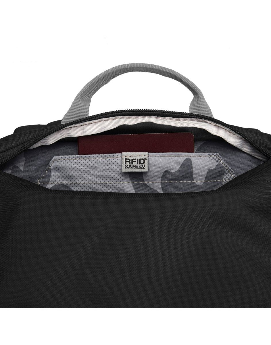 A close-up of the Pacsafe® GO 44L Anti-theft Carry-on Backpack’s open RFID-blocking pocket with a passport inside.