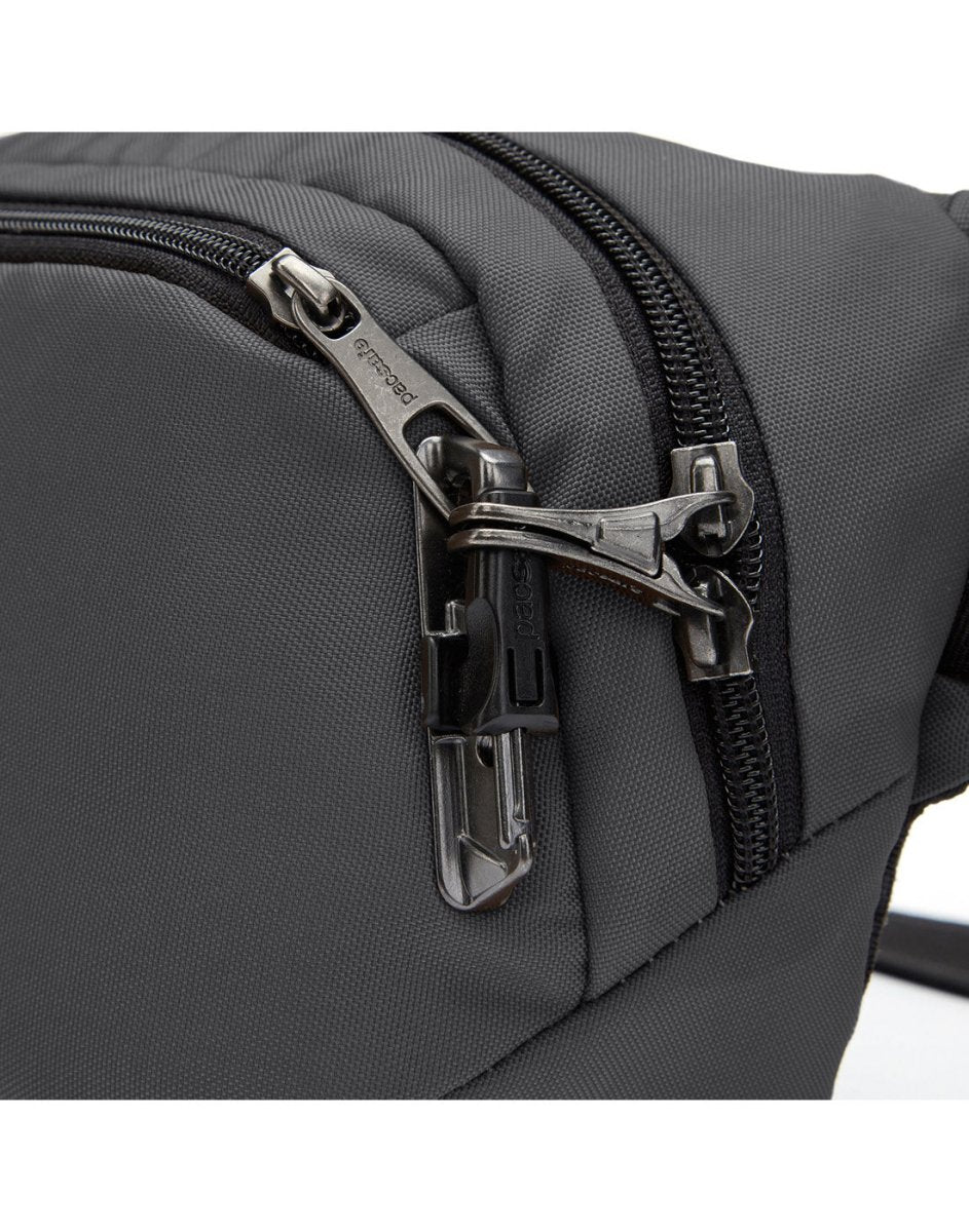 Close-up of the slate Pacsafe® V Anti-theft Hip Pack, made from recycled polyester, with a metal zipper and clip.