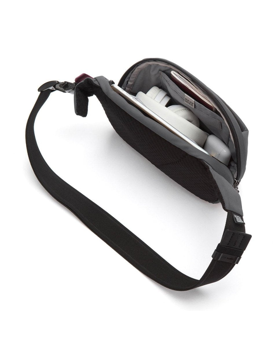 Pacsafe's V Anti-theft Hip Pack easily shows contents like headphones and a book with its lockable zips.