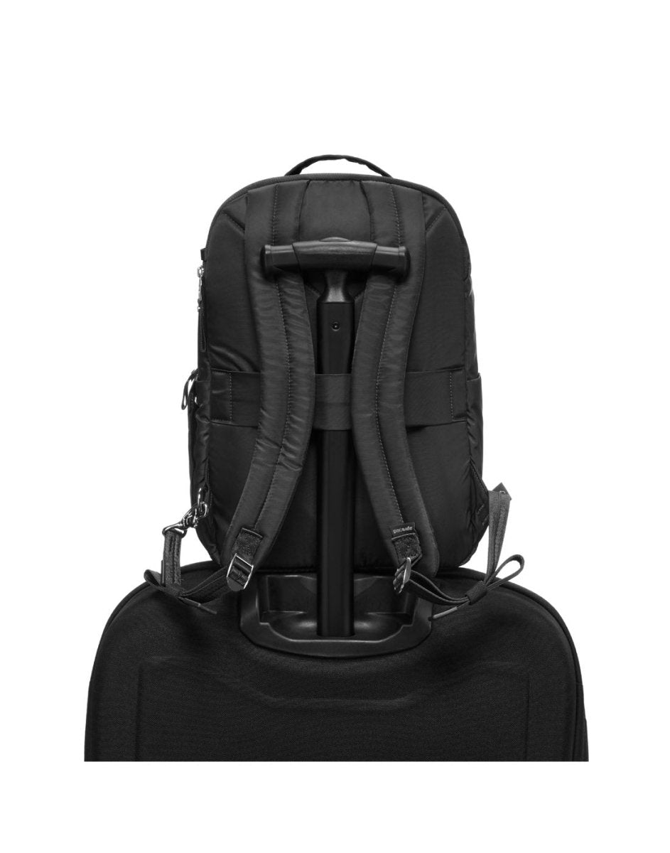 The Pacsafe® W 10L Anti-theft Backpack in recycled polyester secures to a suitcase handle.