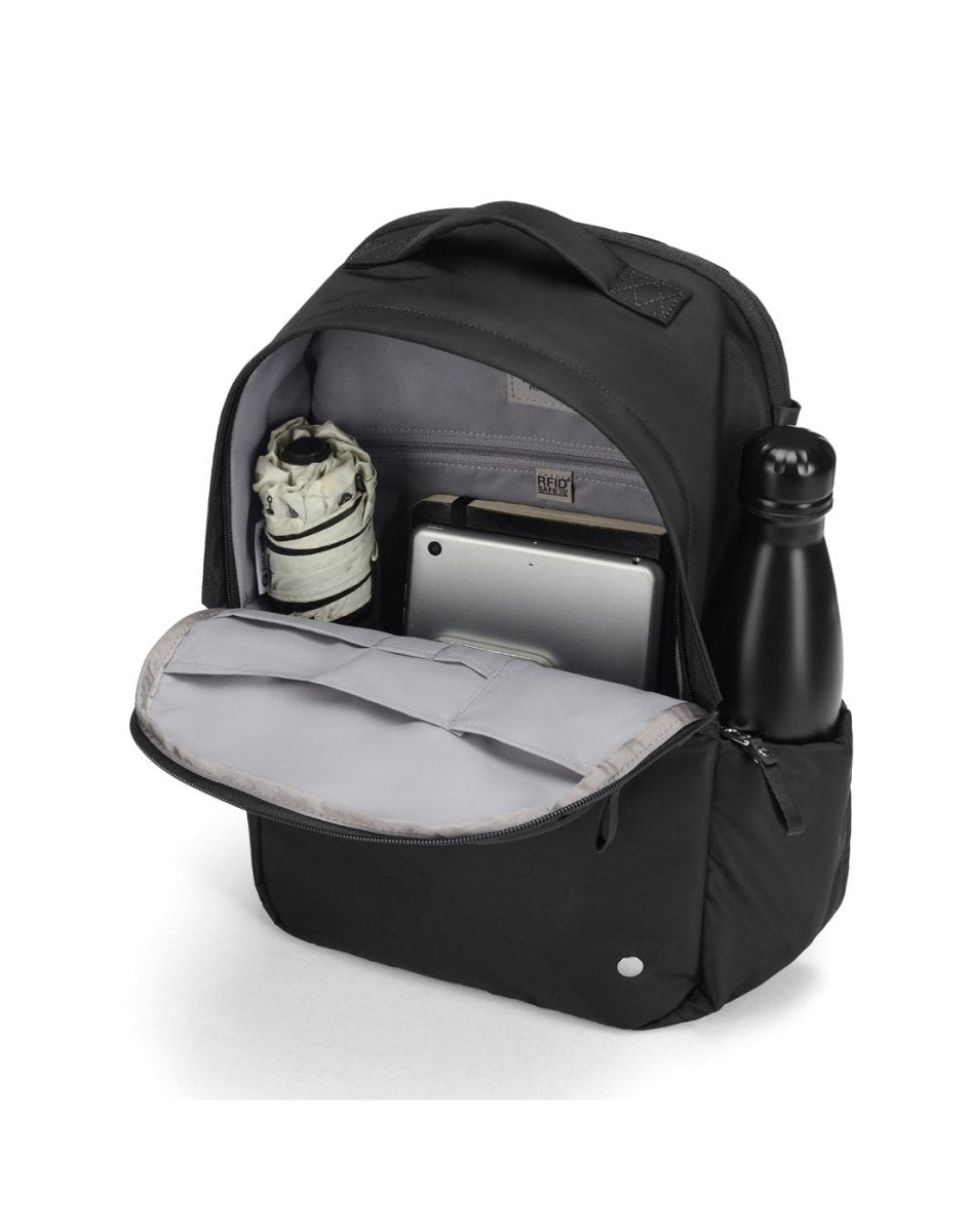 Pacsafe® W 10L Anti-theft Backpack open, showing an umbrella, tablet, and water bottle inside.