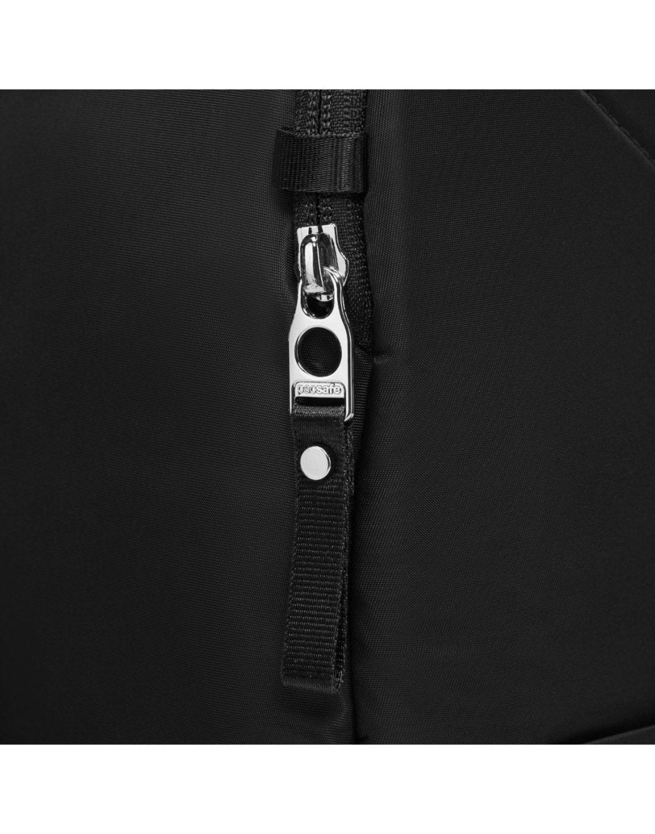 Close-up of Pacsafe® W 10L Backpack's black zipper and strap detail in recycled polyester with silver hardware.