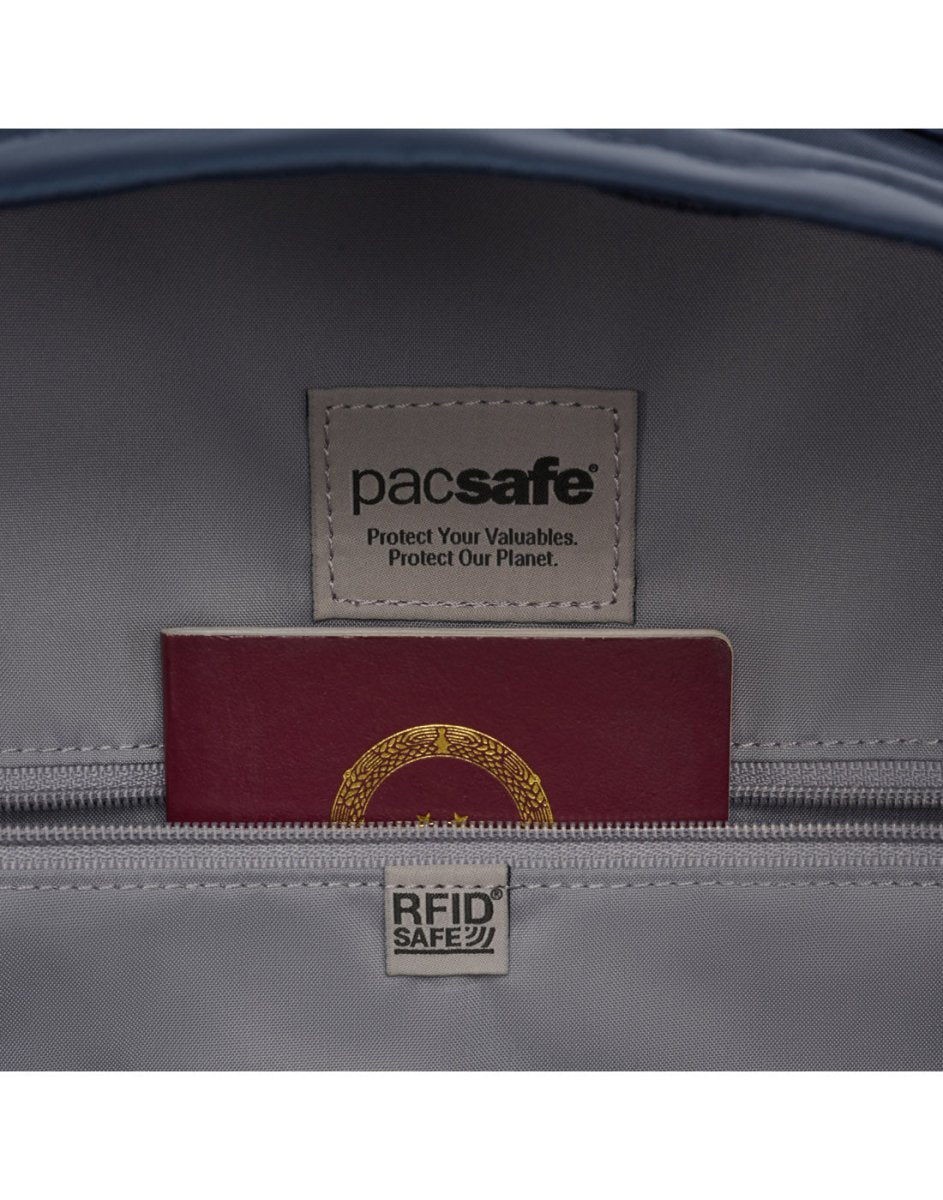 An open pocket reveals a label and passport in the Pacsafe® W 10L Anti-theft Backpack.