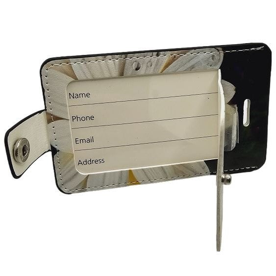 The Ron Risley Art Forget Me Not Luggage Tag features fields for name, phone, email, and address.