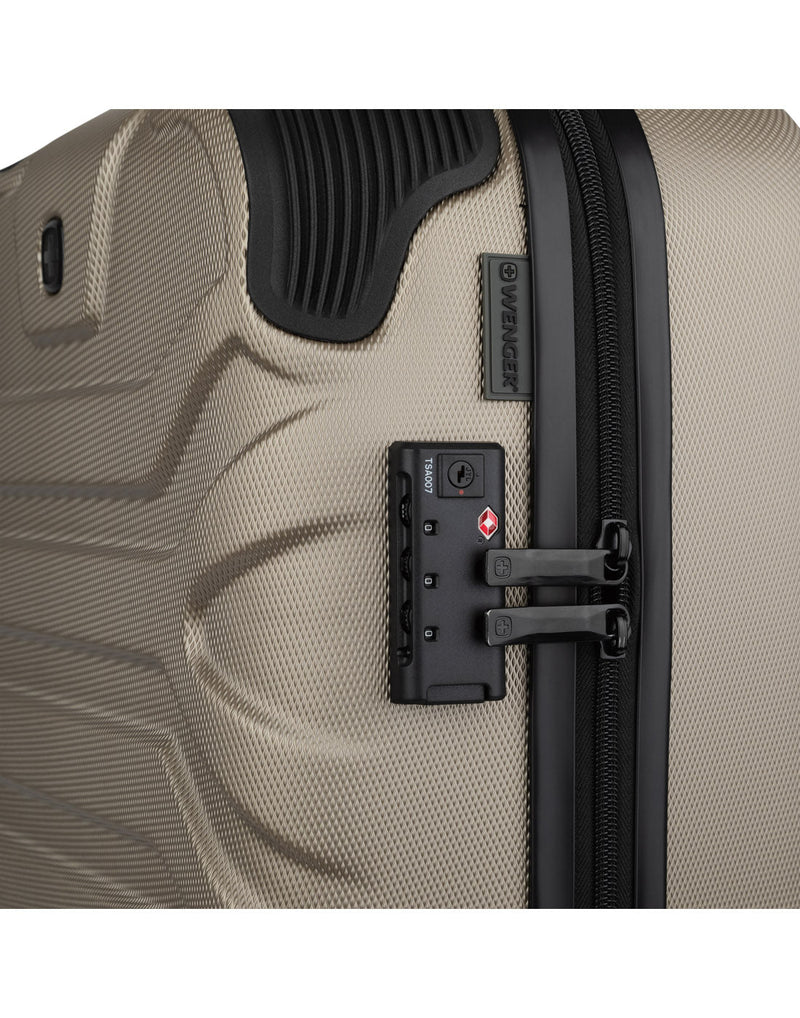 Close up of TSA lock and reinforced corner on Swiss Gear Fortress 19" Hardside Carry-on Spinner in sand colour