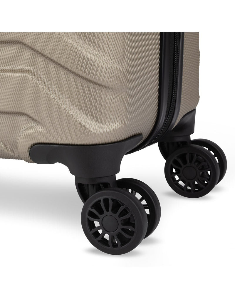 Close up of black spinner wheels on Swiss Gear Fortress 19" Hardside Carry-on Spinner in sand colour