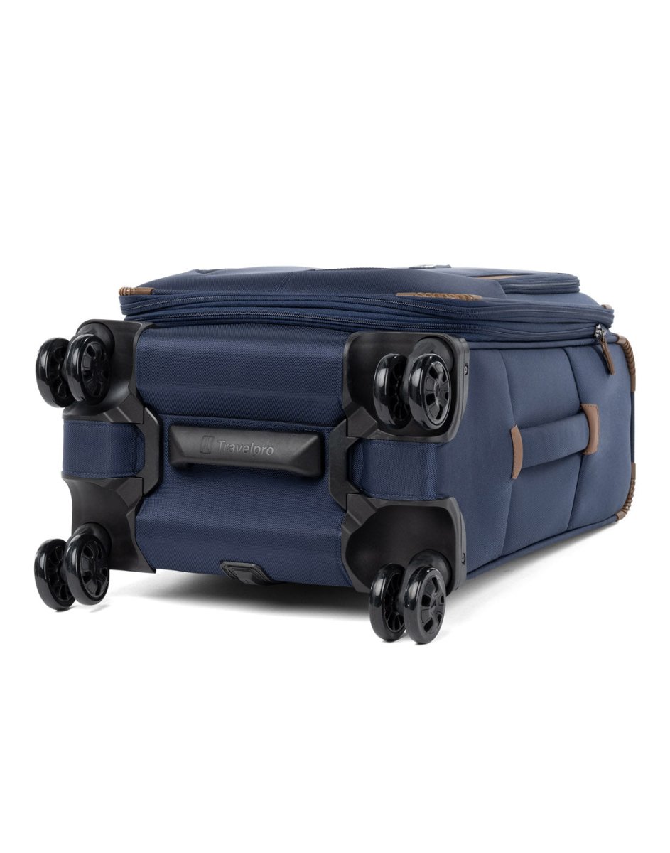 Travelpro Crew™ Classic Carry-on Expandable Spinner in Patriot Blue, bottom view. Showing the eight ultra-durable, 360° MagnaTrac® self-aligning spinner wheels.