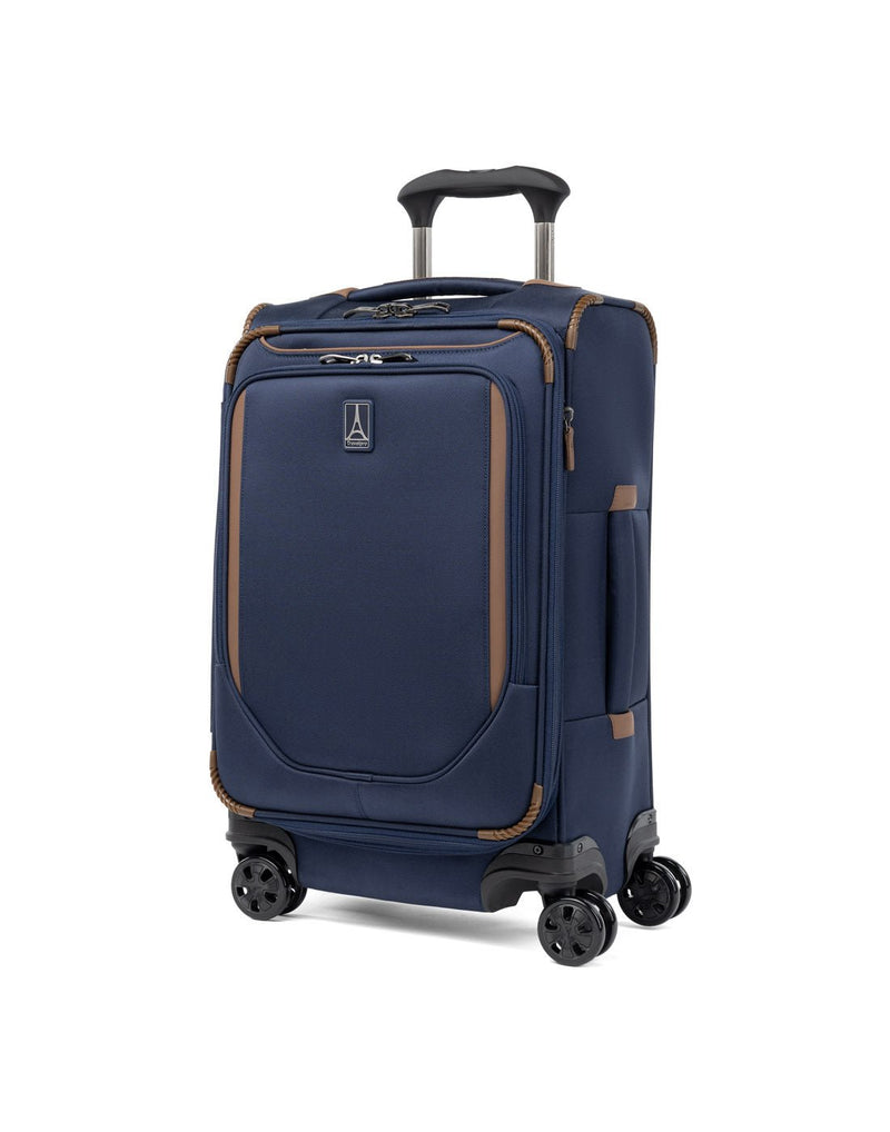 Travelpro Crew™ Classic Carry-on Expandable Spinner in Patriot Blue, front and partial left-side view.