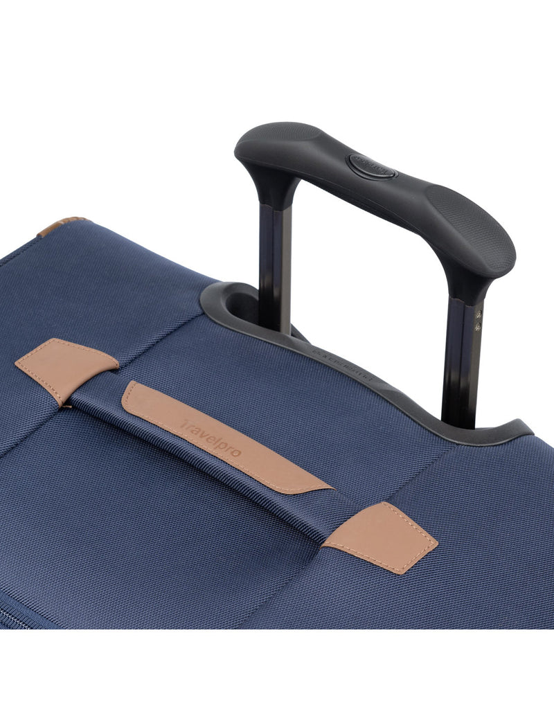 Close up of telescopic handle partially extended on the Travelpro Crew™ Classic Large Check-in Expandable Spinner in Patriot Blue.