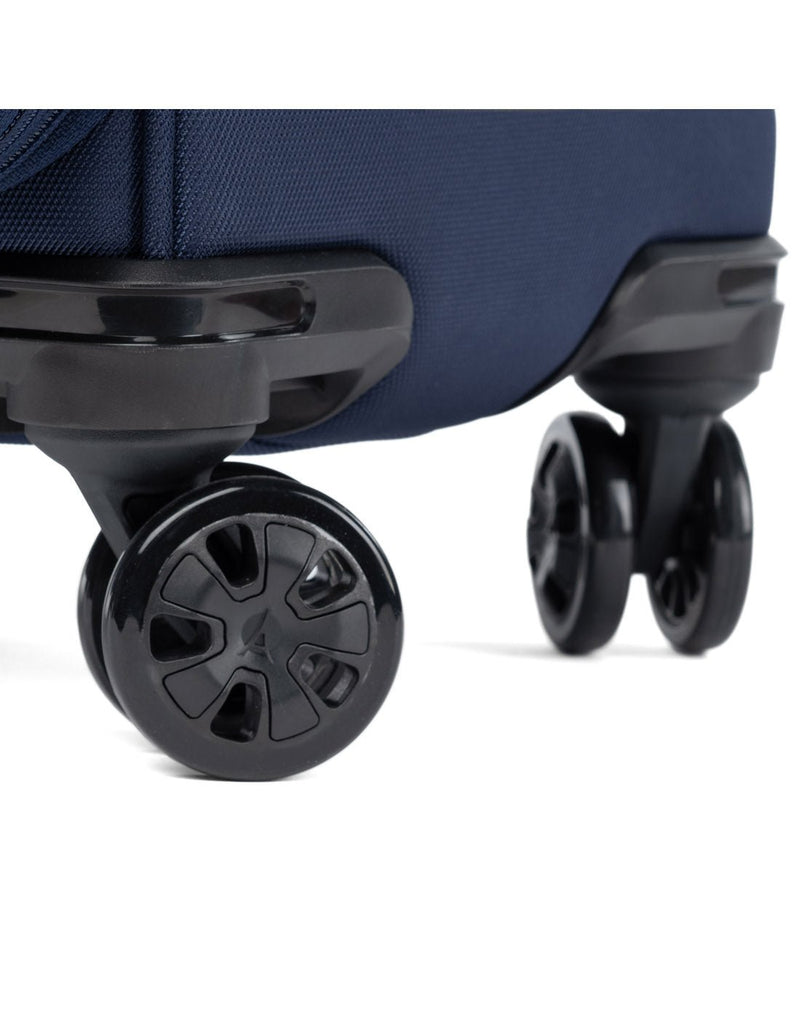 Travelpro Crew™ Classic Large Check-in Expandable Spinner in Patriot Blue. Close-up view of the ultra-durable, 360° MagnaTrac® self-aligning spinner wheels.