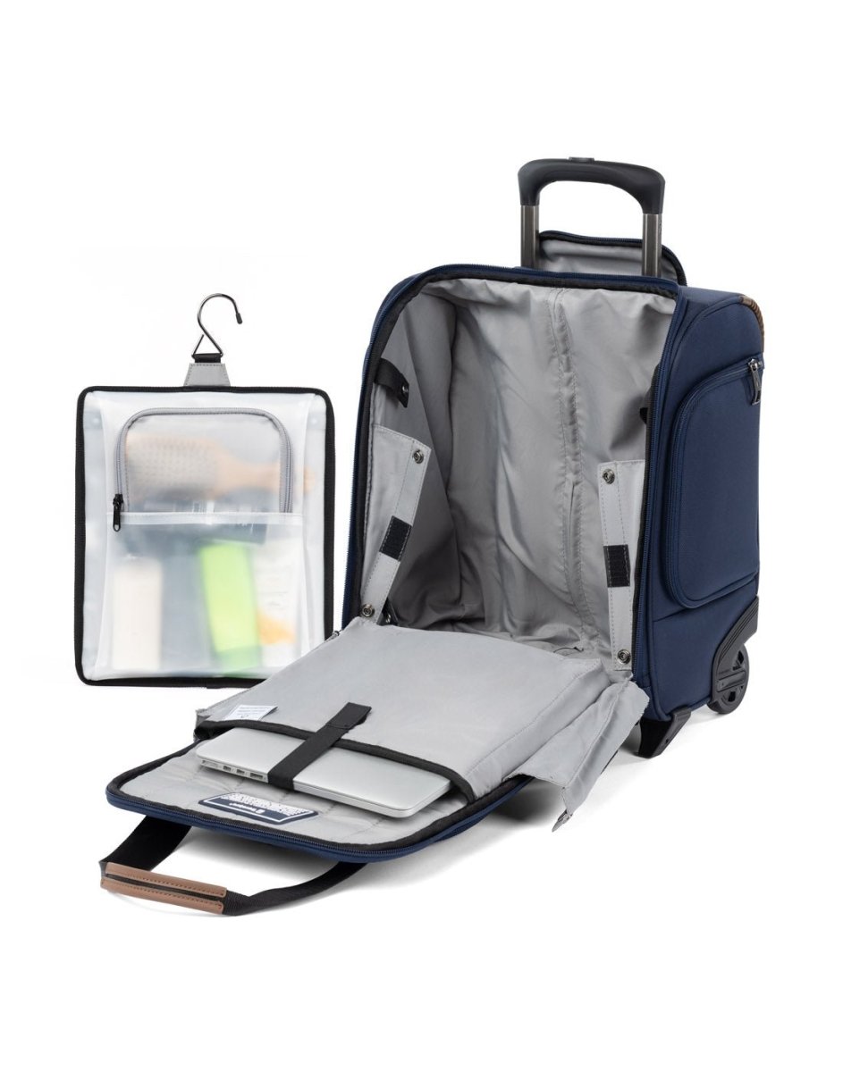 Travelpro Crew™ Classic Rolling Underseat Carry-on in Patriot Blue, front view. Un-zipped showing the interior padded sleeve protects laptops up to 14" and standard-sized tablets. Image also shows the removable, hanging organizer has water-resistant storage for toiletries or damp items.