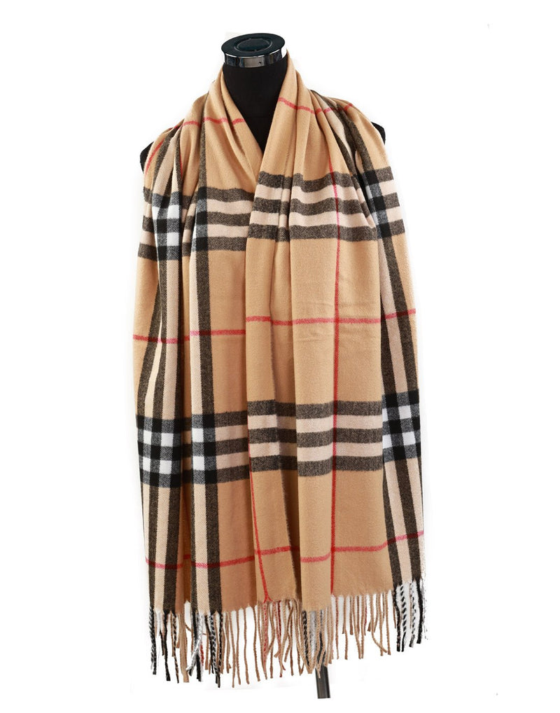 Alina's Plaid Scarf in beige with white, black and red, hanging on a mannequin