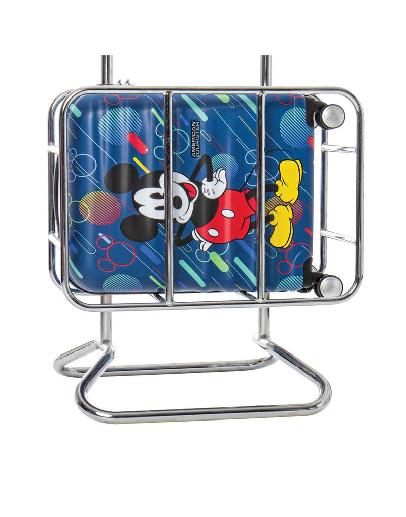 American Tourister Disney Wavebreaker Spinner Carry-on - Mickey Future Pop in an airline cradle