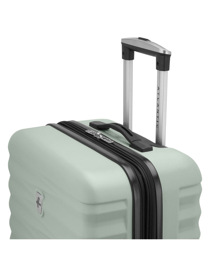 Atlantic Chaser Hardside 24" Expandable Spinner in seagrass light green colour, top side view with black and silver telescopic handle extended