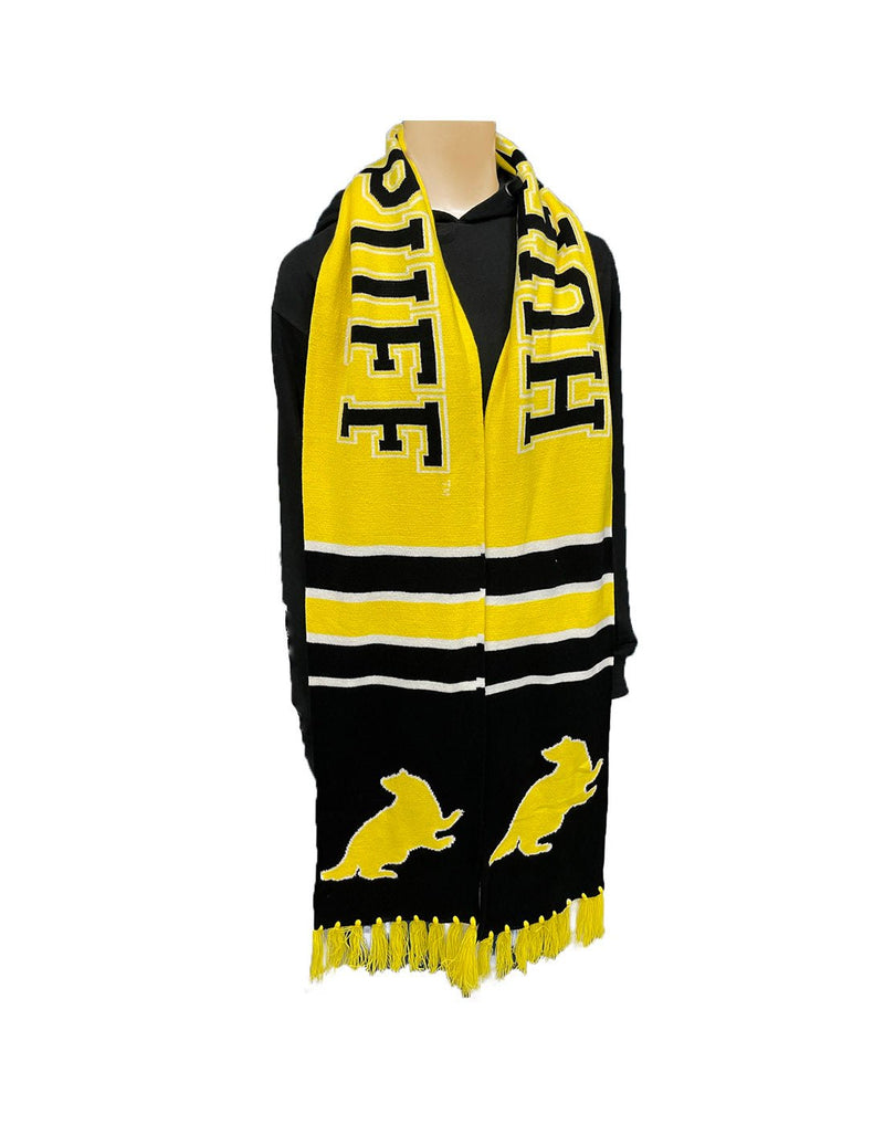 Black and yellow Hufflepuff team scarf with yellow tassels and badger symbol; hanging on manequin