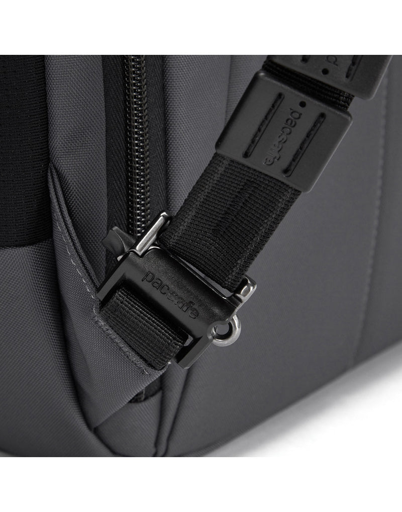 Close up of security clip on strap of slate bag