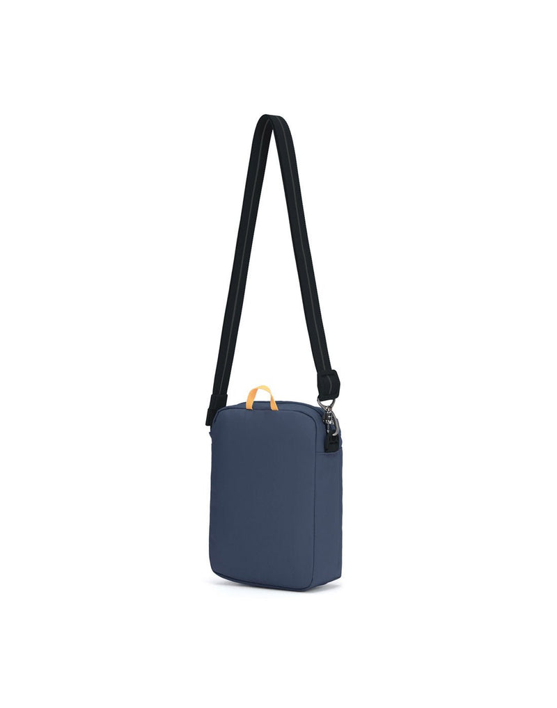 Pacsafe® GO Anti-Theft Festival Crossbody in coastal blue colour, back view with cut-resistant shoulder strap fully extended.