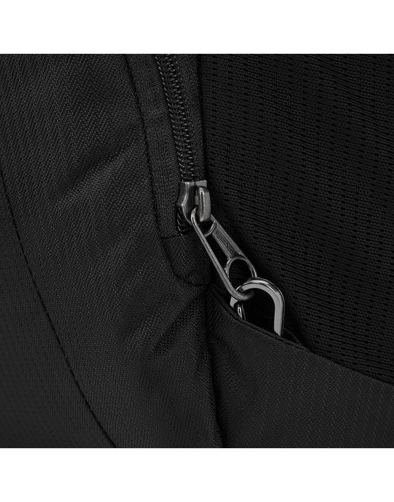 Close up of zipper pull secured to safety clip