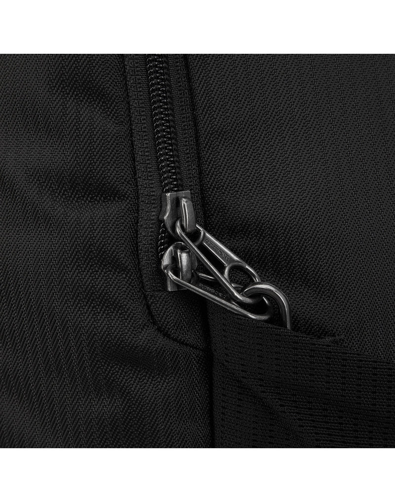 Close up of zipper pulls secured to safety clip