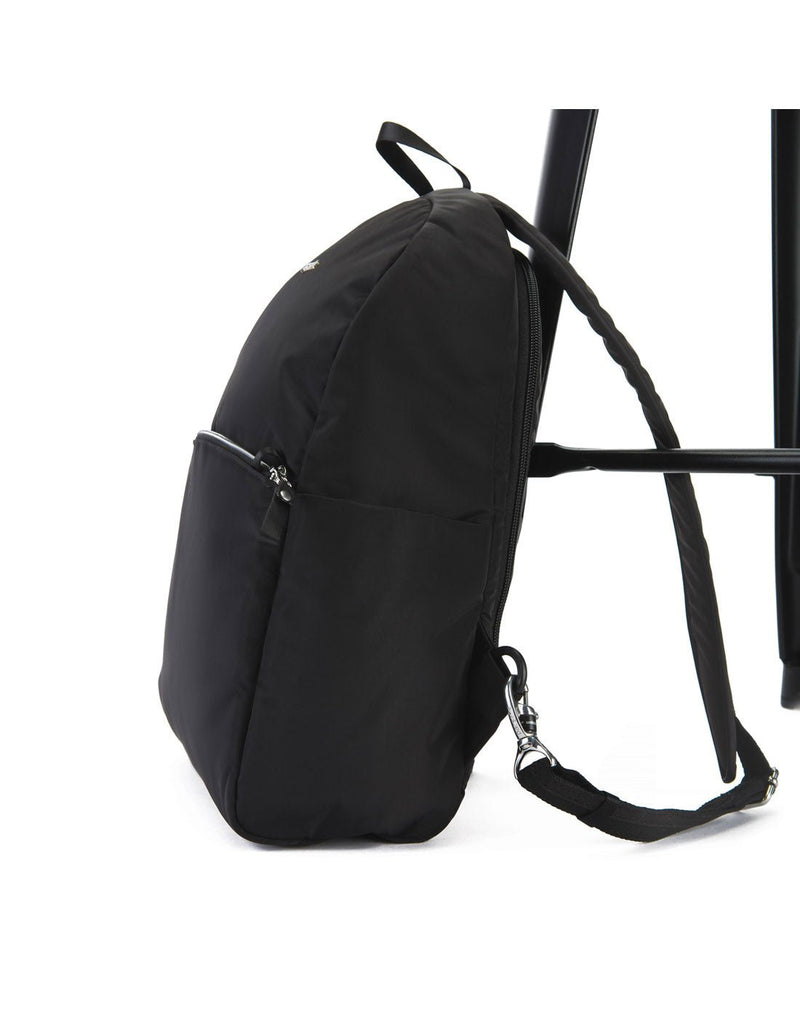Pacsafe Stylesafe Anti-theft Backpack, black, side view strapped to a chair leg