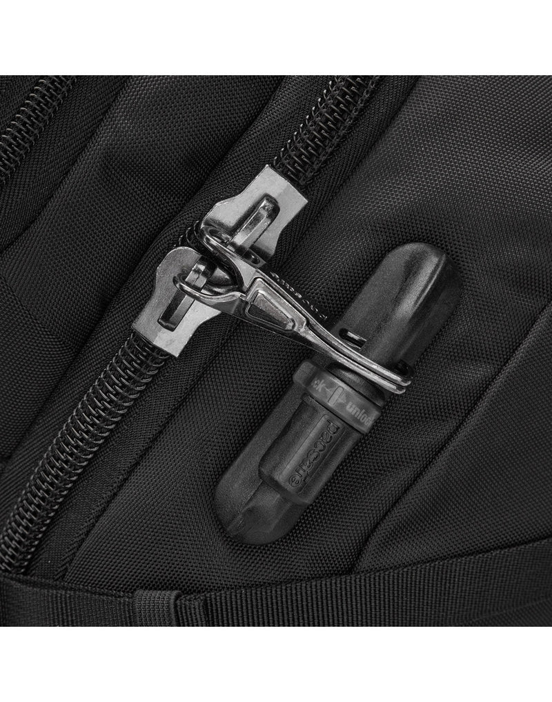 Close up of zipper pulls secured to safety latch on black bag