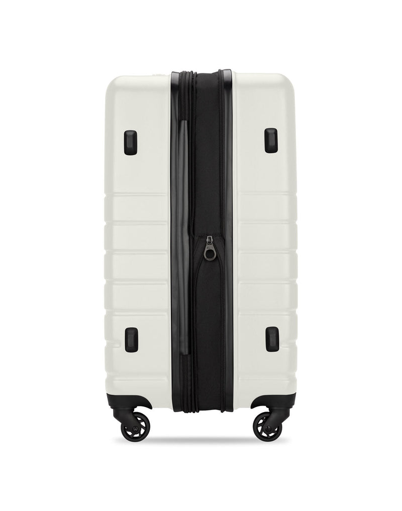 Roots Panorama 24" Hardside Expandable Spinner in tofu, white colour, side view of black side feet and zipper expanded