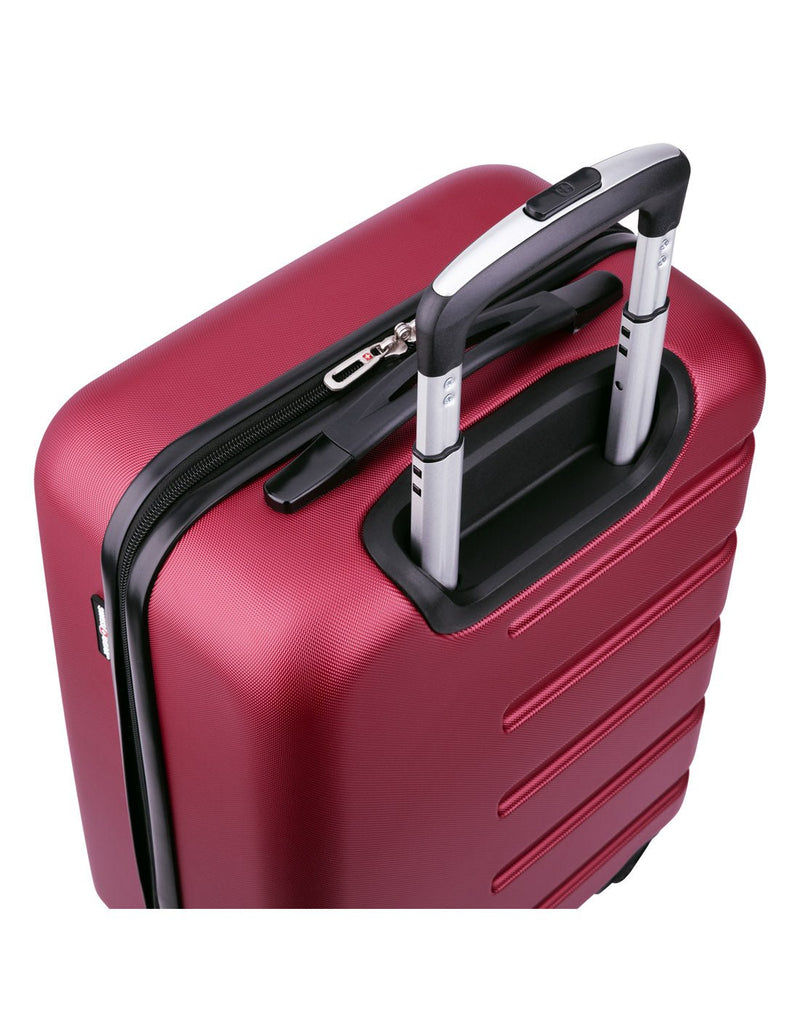 Close up of red luggage with telescopic handle extended